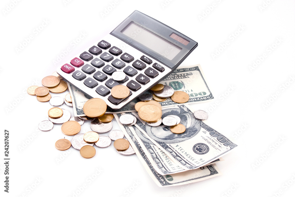 Calculator, coins and dollar banknotes isolated on white Calculator, coins and dollar banknotes isolated on white