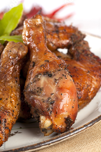 homemade smoked chicken drumstick on a plate, shallow DOF