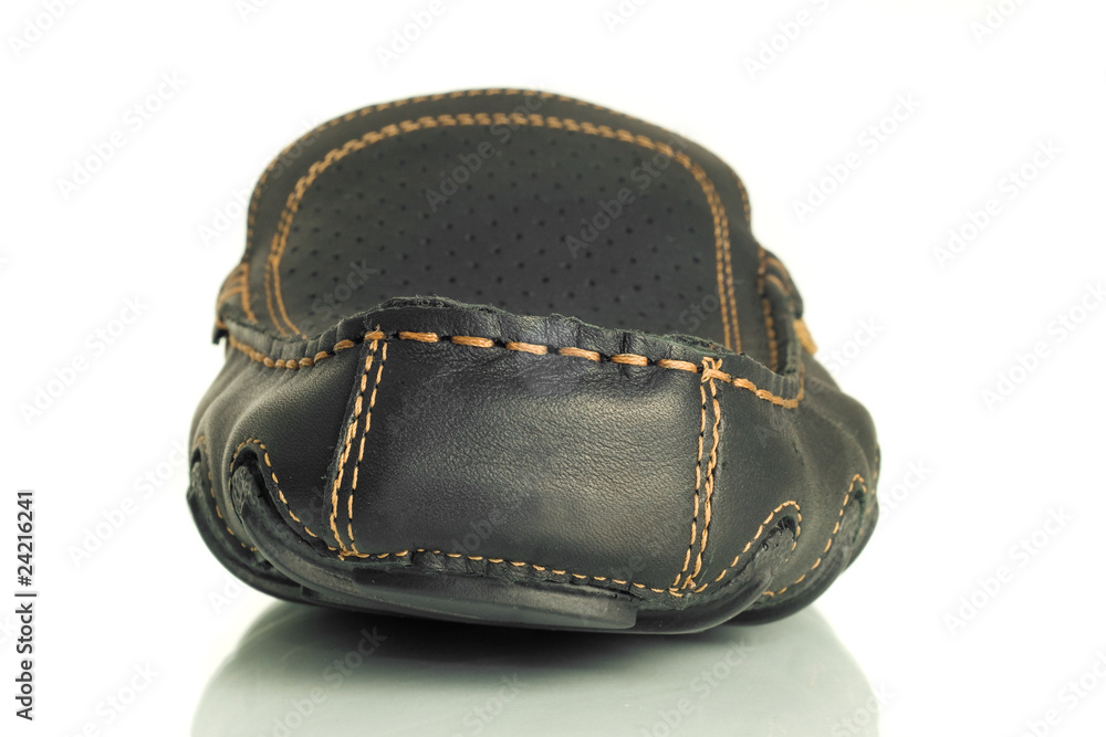 Close-up of single black mens moccasin Close-up of single black mens moccasin
