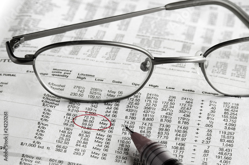 Stock chart and glasses with price circled in red