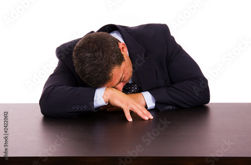 mature business man sleeping on the desk