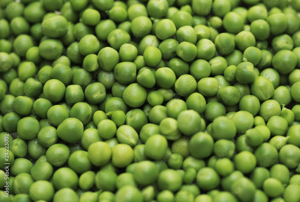Shelled fresh ripe green peas background Shelled fresh ripe green peas background