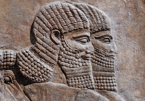 Detail of an ancient relief of two assyrian warriors