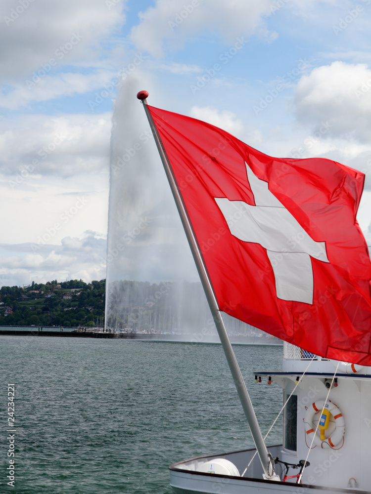 swiss flag in front of Geneva water jet