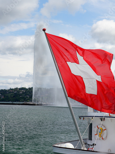 Obraz na płótnie swiss flag in front of Geneva water jet w salonie
