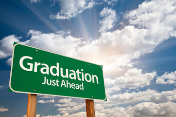 Graduation Green Road Sign Over Clouds