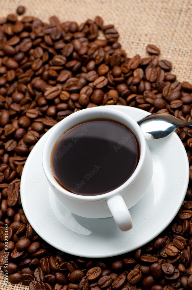 Cup of coffee on coffee grains Cup of coffee on coffee grains