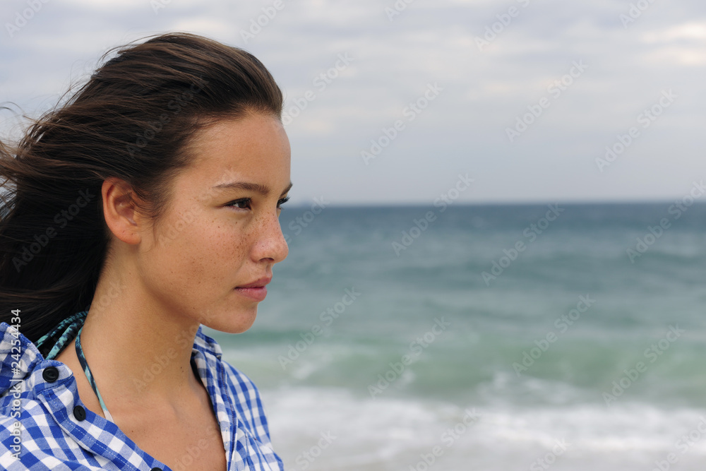 attractive woman at the sea facing the future