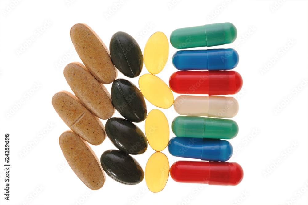 different pills on a white background different pills on a white background
