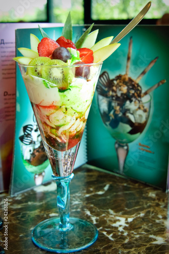 Ice-cream with fruits in the bowl