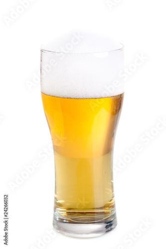 Fresh beer in a glass isolated on white.