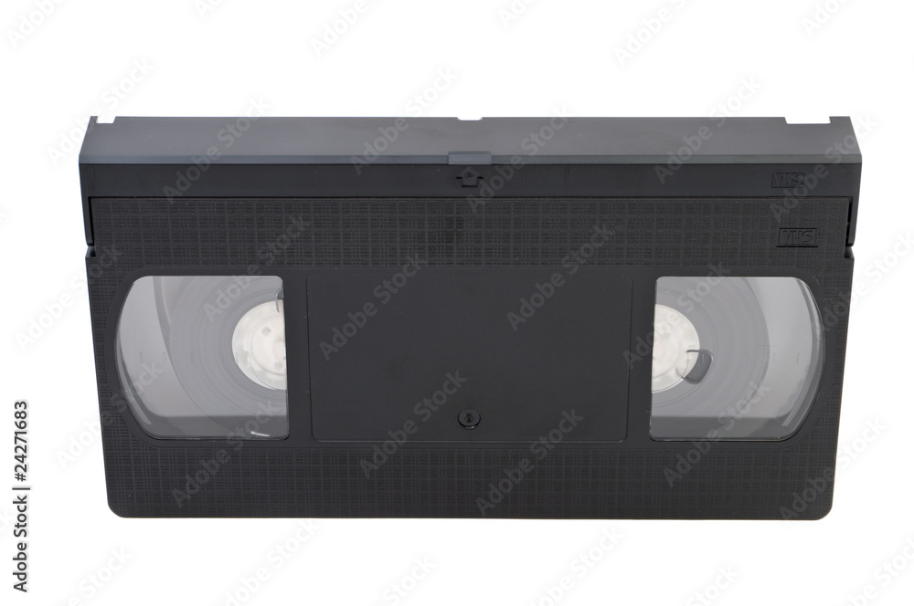 Old obsolete videocassette on white background
