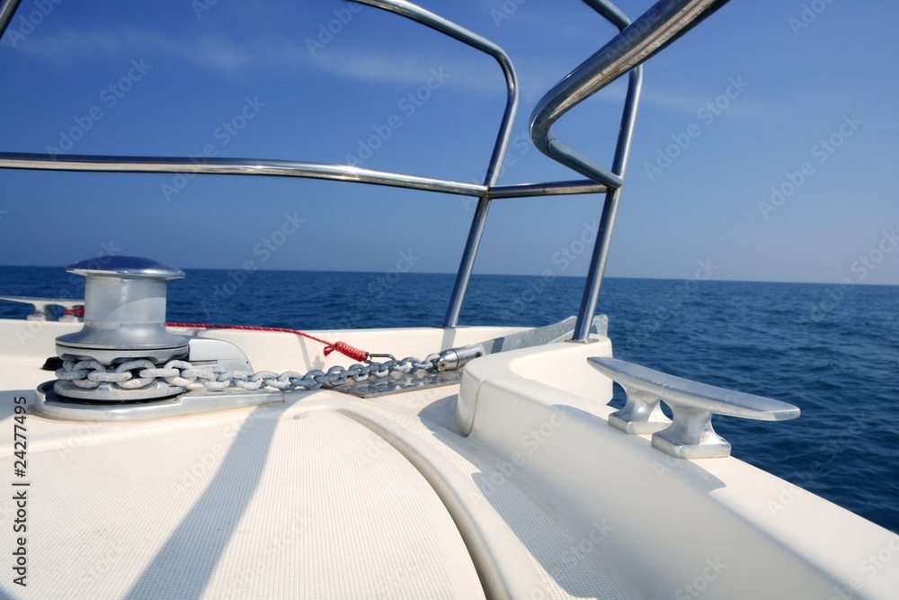 Fototapeta premium boat bow sailing sea with anchor chain winch