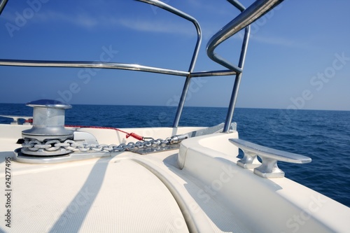 boat bow sailing sea with anchor chain winch © lunamarina