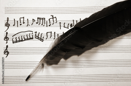 Musical score and pen feather