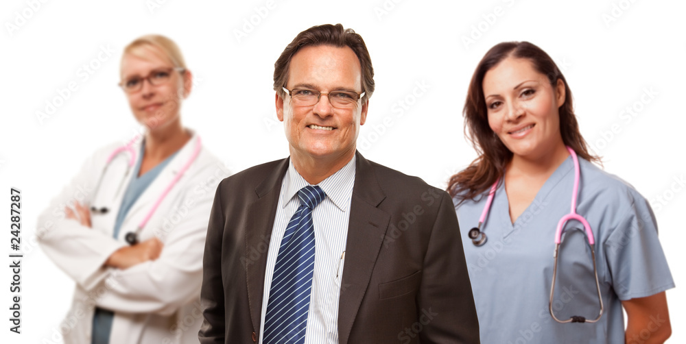 Smiling Businessman with Female Doctor and Nurse Smiling Businessman with Female Doctor and Nurse