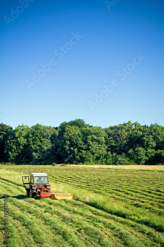 Tractor working on green field