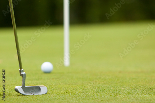Putting a golf ball towards the pin