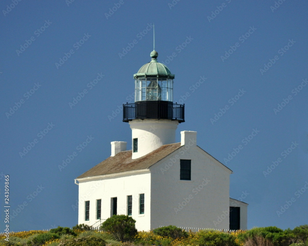 Old Lighthouse against a Blue Sky.