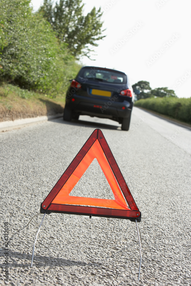 Car Broken Down On Country Road With Hazard Warning Sign Car Broken Down On Country Road With Hazard Warning Sign