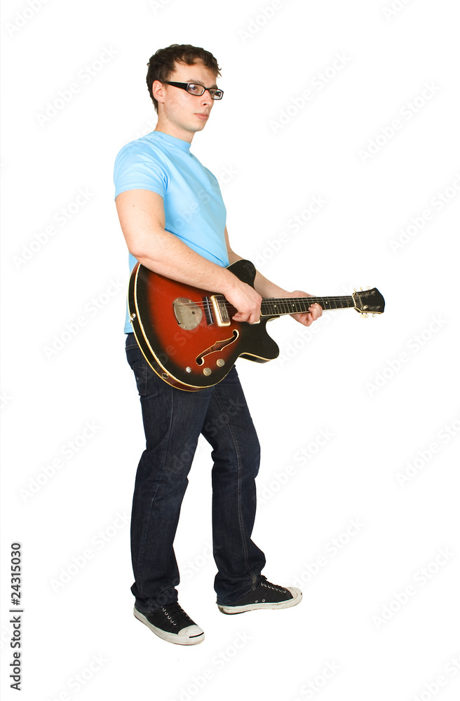 young man in glasses and blue shirt playing guitar isolated on w young man in glasses and blue shirt playing guitar isolated on w