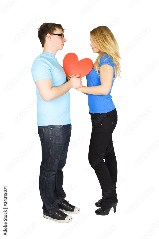 young man in glasses and blond girl holding red paper heart, loo young man in glasses and blond girl holding red paper heart, loo