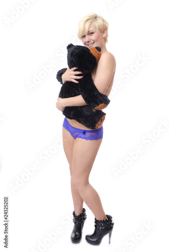 Sexy woman cuddling teddy bear © Warren Millar