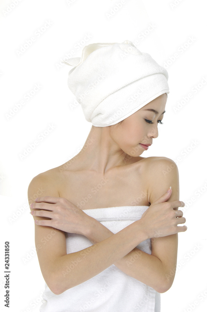 Beautiful girl in a towel on white background Beautiful girl in a towel on white background