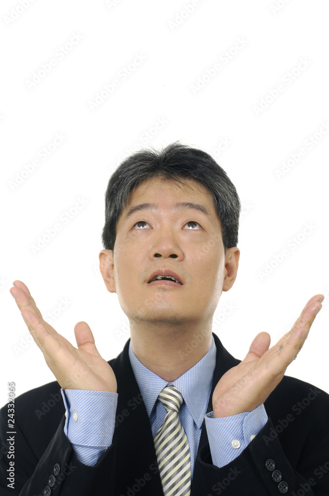 Stock photo of a surprised businessman looking up Stock photo of a surprised businessman looking up