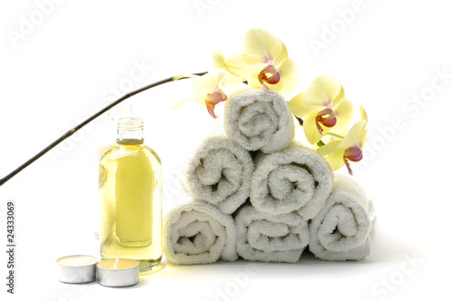 Spa essentials –roll towel ,lotion ,candle ,and orchid
