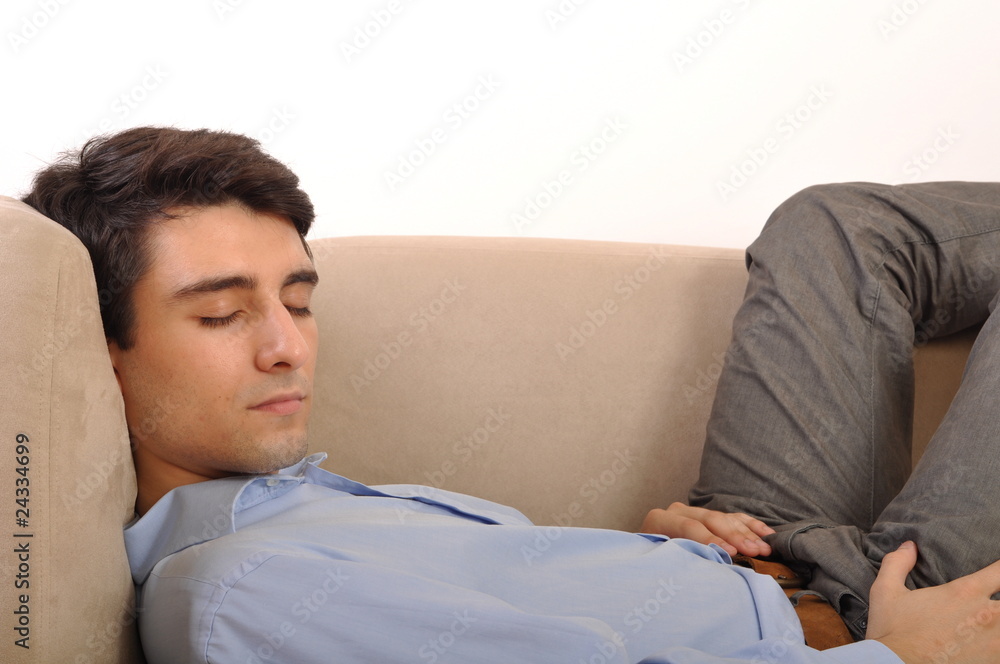 Fototapeta premium Man sleeping on the couch