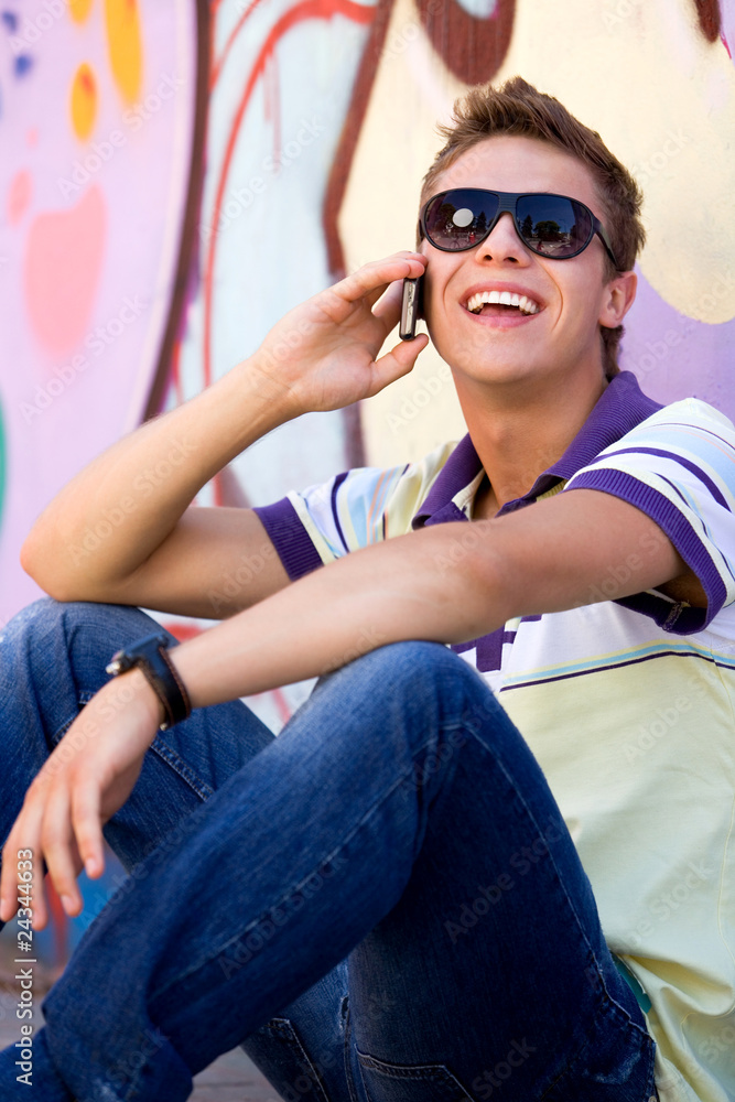 Young man using mobile phone Young man using mobile phone