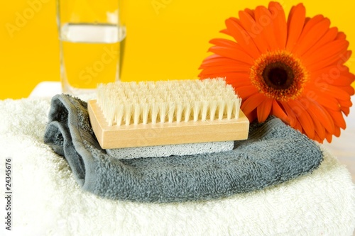 A SPA set with towels and a red gerber