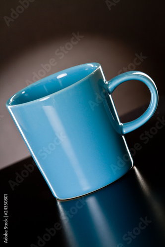 Blue cup on a grey gradient background