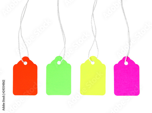 Four colorful blank price tags with string isolated on white. 