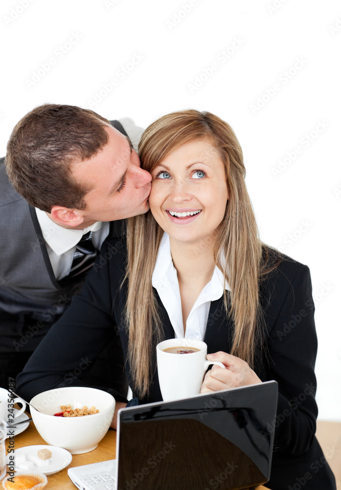 Attractive businessman kissing his bright girlfriend Attractive businessman kissing his bright girlfriend