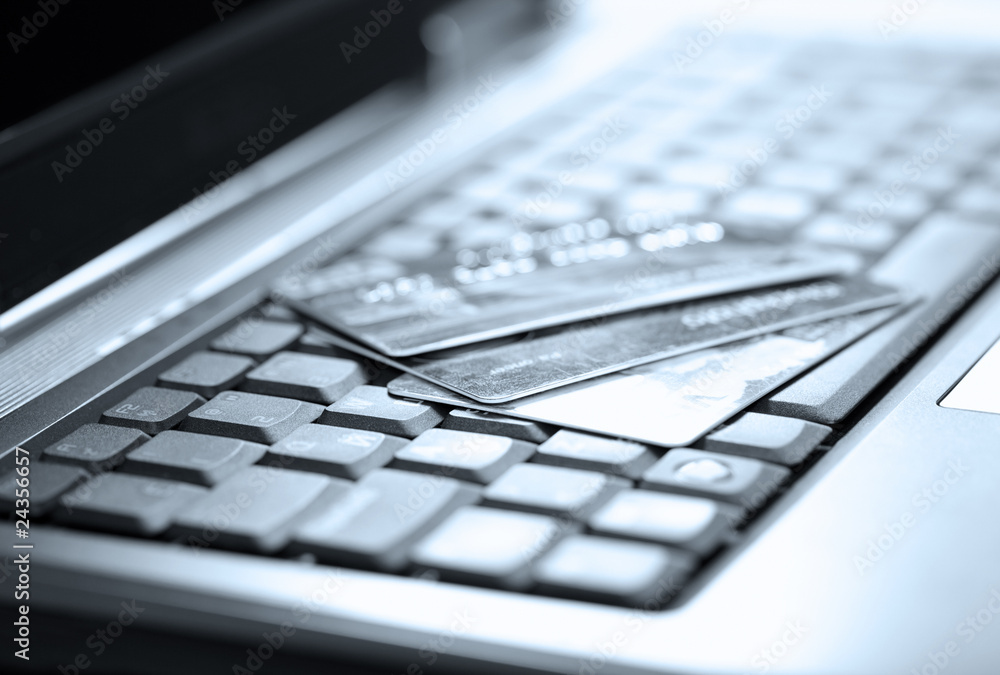 Credit cards and laptop. Shallow DOF