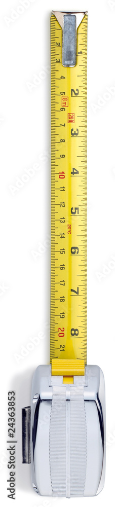 silver retractable measuring tape from overhead on a white backg silver retractable measuring tape from overhead on a white backg