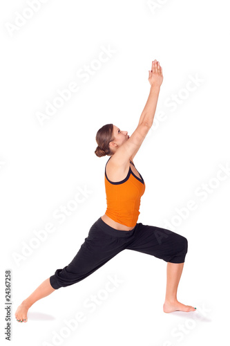Woman Practicing Warrior Pose 1 Yoga Exercise © Artur Bogacki