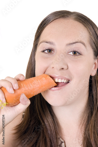 girl gnaws a carrot