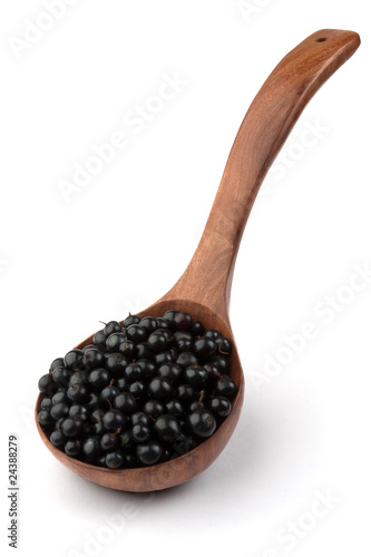 currant in a wooden spoon