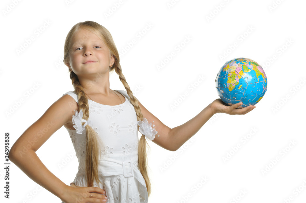 The girl holds the globe collected from puzzle in hands. Selecti