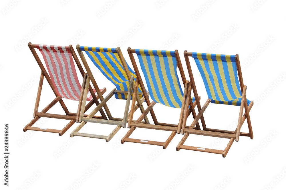 Four striped British deckchairs, isolated on white