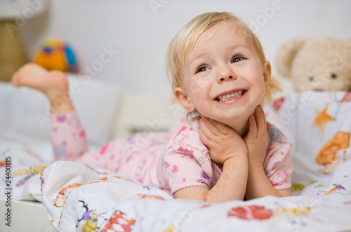 little girl in bed