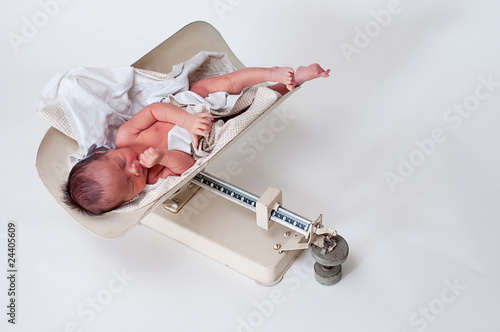 Newborn being weighed