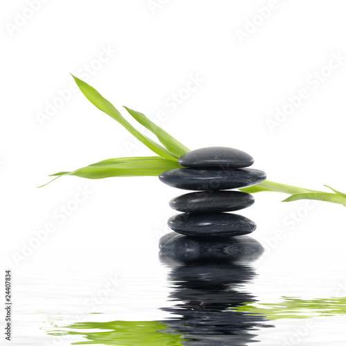 Balanced with black stones with reflection