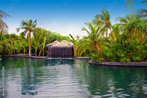 Maldives. .Pool with small fall in tropical garden. © Konstantin Kulikov