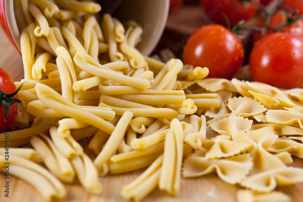 Raw casarecce and farfalle pasta