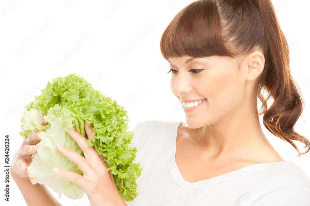beautiful housewife with lettuce over white beautiful housewife with lettuce over white