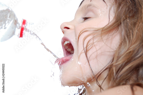 thirsty child drinking water photo